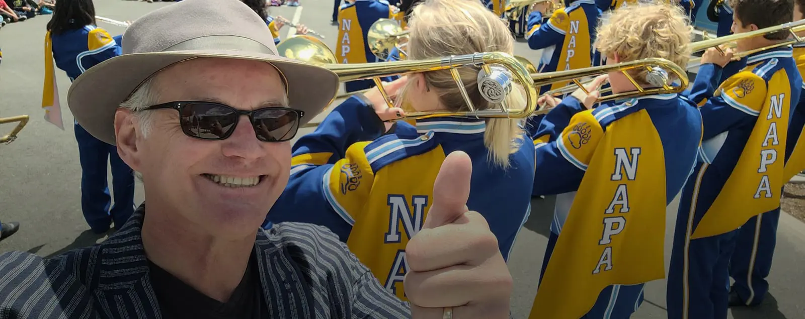Man smiling with Napa school band in the background