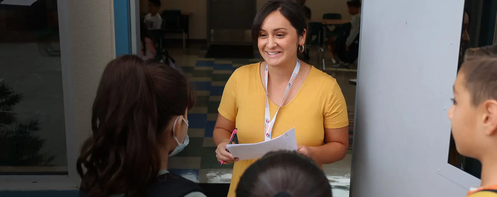 Teacher smiling at students