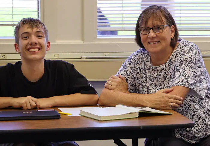 Teacher smiling with student