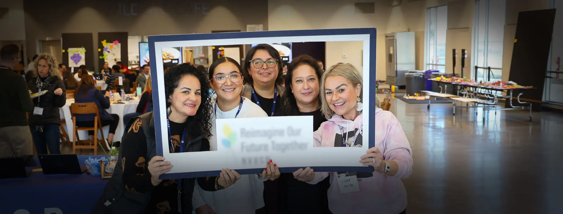 Group of diverse teachers smiling through the frame