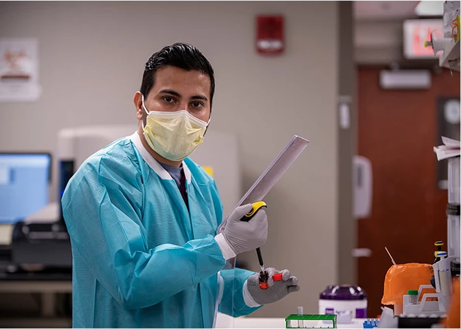 An employee working in a clinical laboratory.