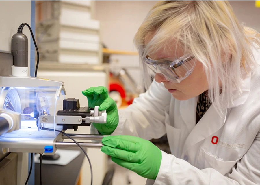 A researcher using a mass spectrometer.