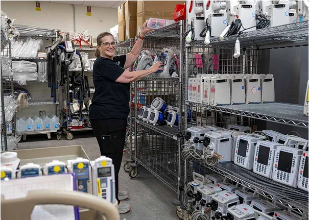 A Supply Chain team member packing medical supplies.