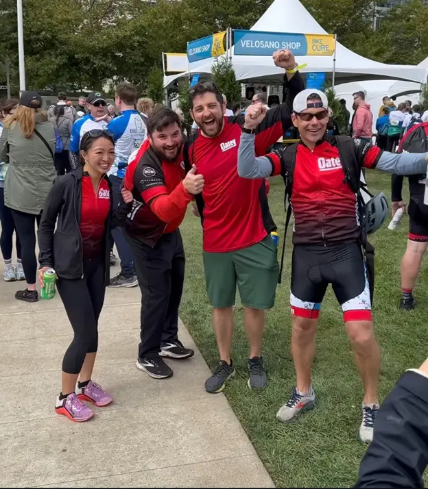 Oatey employees celebrating at a charity cycling event.