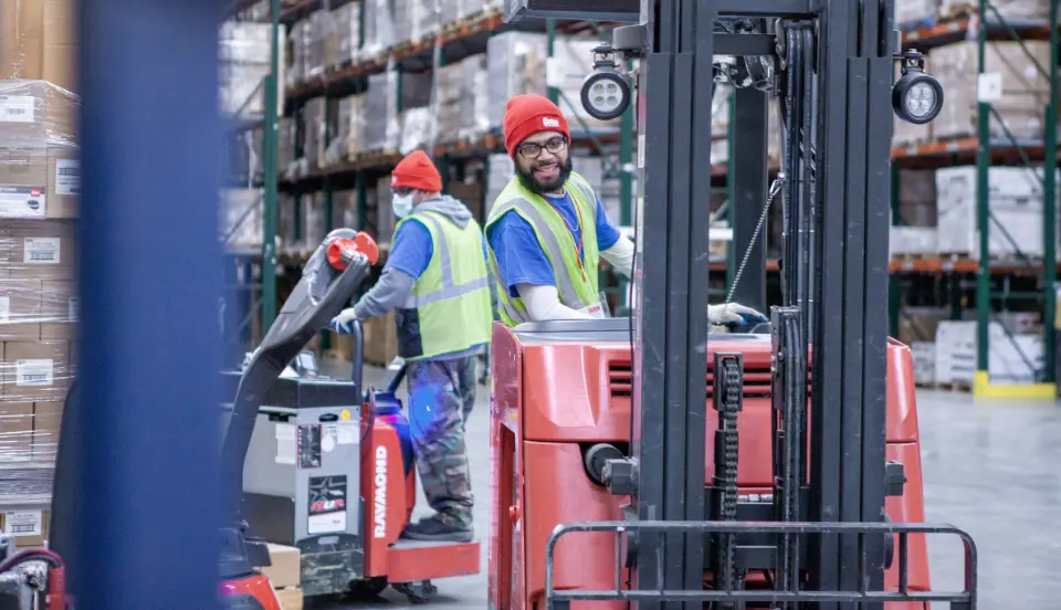 Oatey distribution employee operating a forklift.