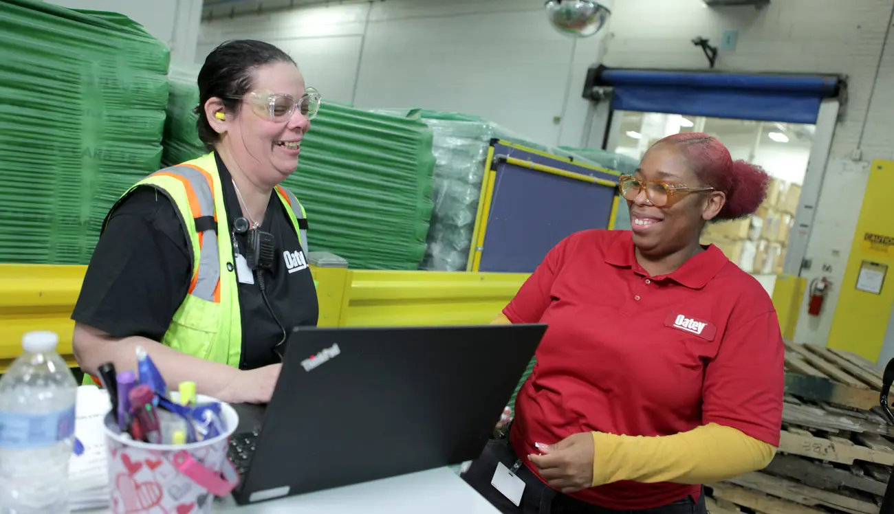 Oatey distribution employees discussing a project.