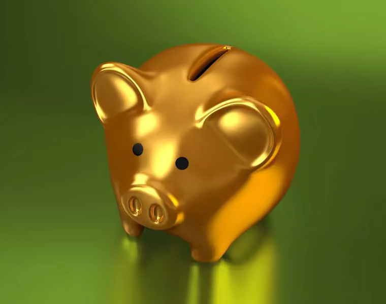 A small gold piggy bank.