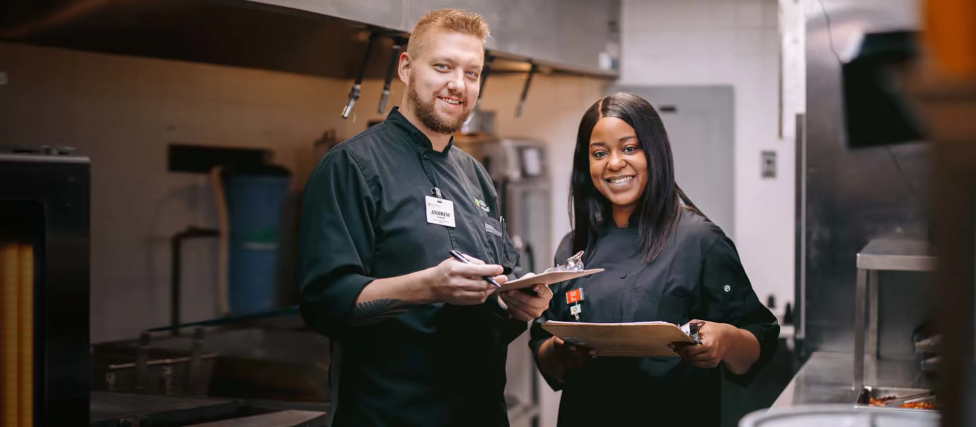 An Ohio Living dining staff member serving a resident in the community restaurant.