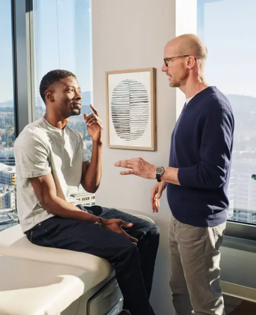 One Medical physician speaking to a patient.