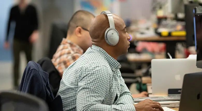 One Medical employee working on a computer.