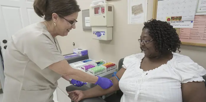Phoebe Physicians professional doing a blood draw on a patient