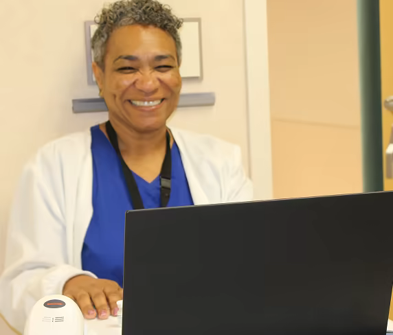 A smiling Parrish Healthcare allied health Care Partner.