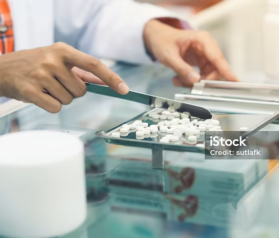 A Parrish pharmacy team member preparing medication.