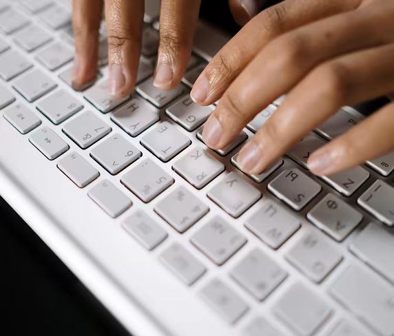 A Parrish corporate Care Partner working at a keyboard.