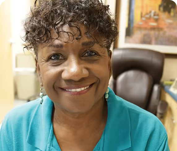 A smiling Parrish Healthcare non-clinical Care Partner.