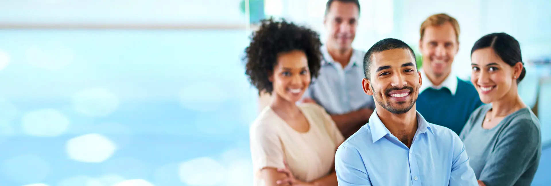 A diverse group of smiling employees.