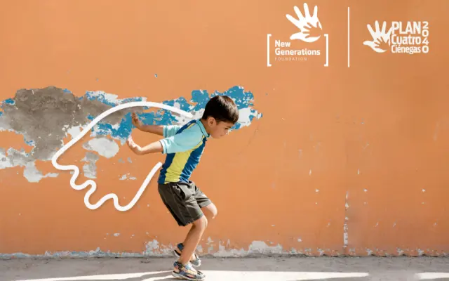 A young boy pretending to fly with a wing graphic behind him.