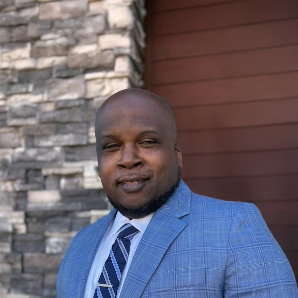 A Red Lobster General Manager standing outside and smiling.
