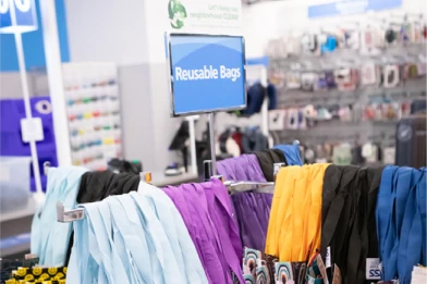 A display of reusable bags inside a Ross retail store
