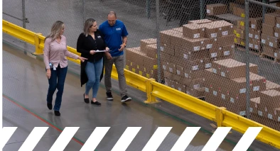 Ross Associates at a distribution center following safety protocol by walking inside a protected lane