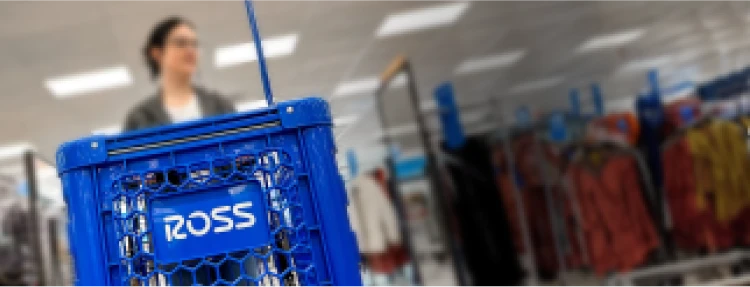 Customer pushing a Ross shopping cart in a store