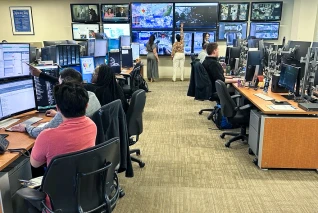 Ross Associates at a logistics center monitor and plan distribution routes