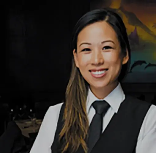 Ruth's Chris Steakhouse bartender smiling at guests