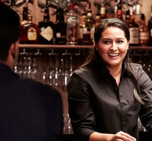 Ruth's Chris Steakhouse bartender smiling at guests