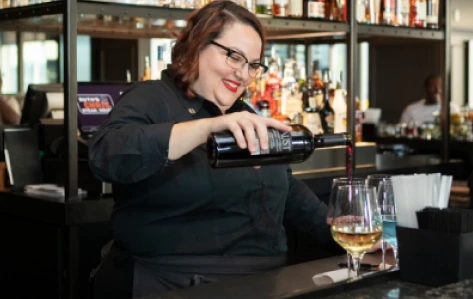 Waiter arranging dining napkin at Ruth's Chris Steakhouse