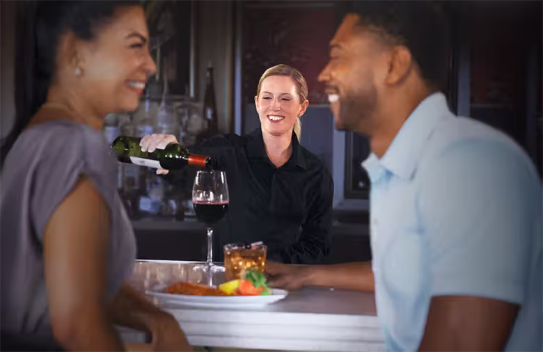 Ruth's Chris Steakhouse hostess smiling at guests