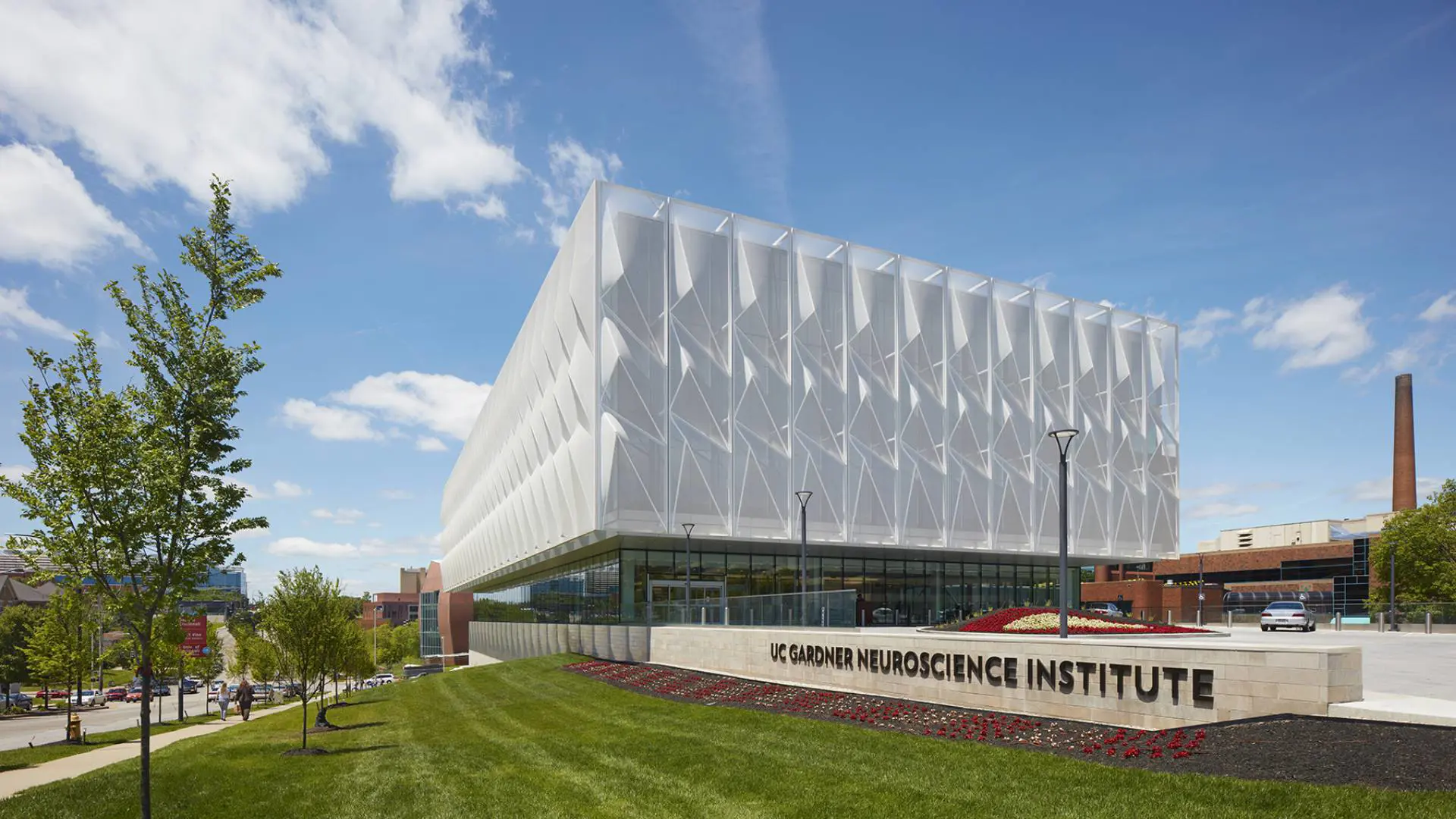 The front of the UC Gardner Neuroscience Institute on a bright spring day.