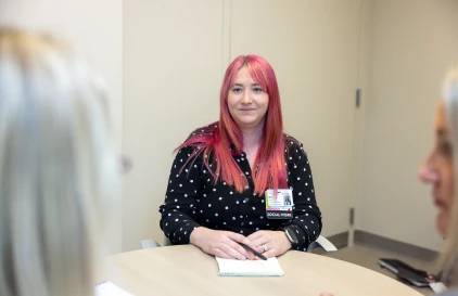 A smiling UC Health team member.