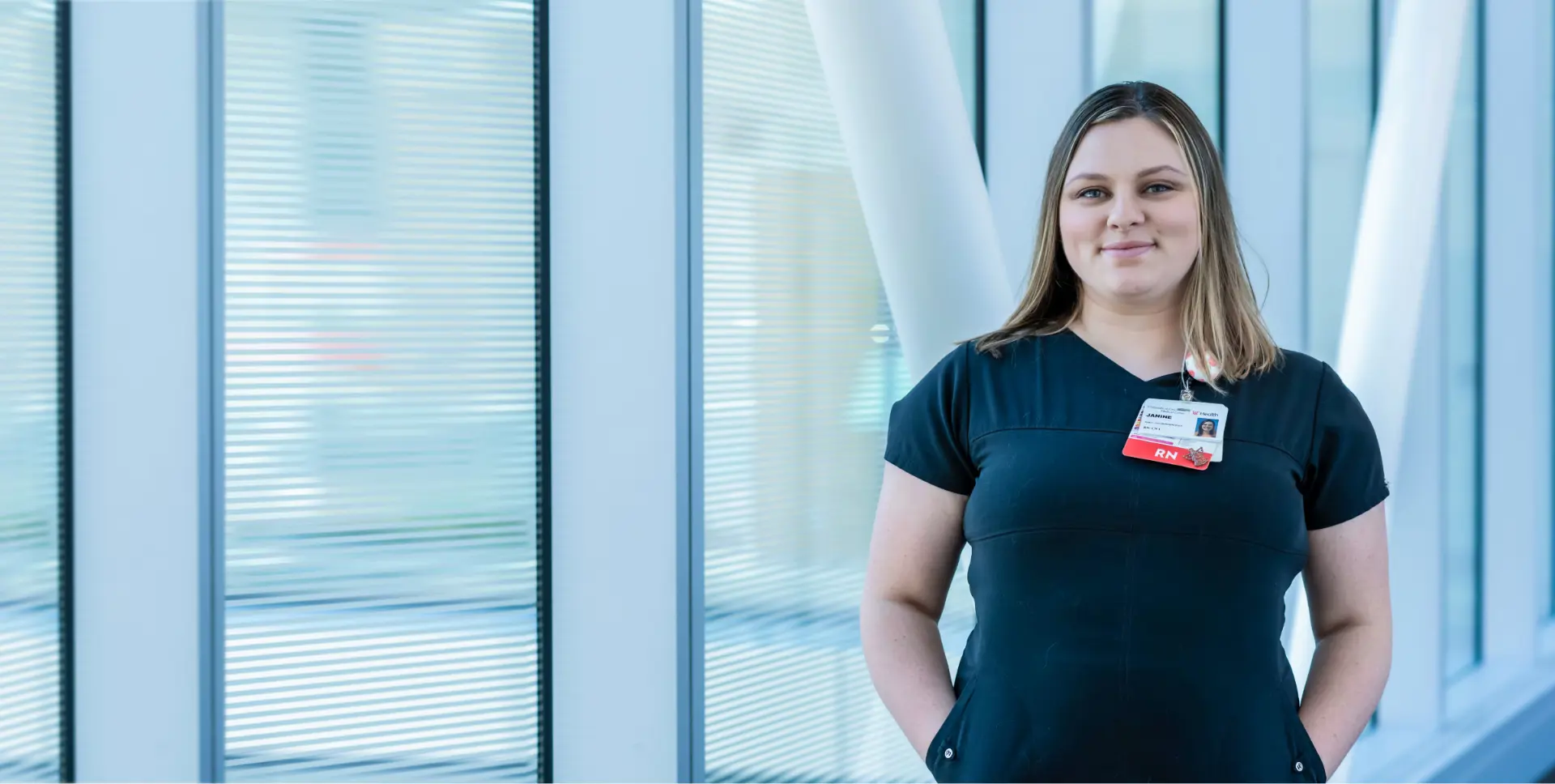  	A young female employee pauses during her workday at the First-Year Onboarding Academy.