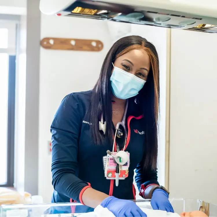 A nurse smiles as she reflects on the UC Health medical benefits package.