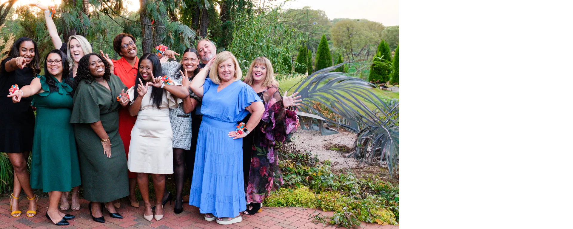 A group of WCPSS staff standing and celebrating.