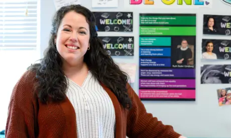 A Wake County educator smiling in a classroom.