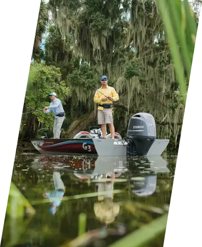 Two fishermen standing on a G3 boat.