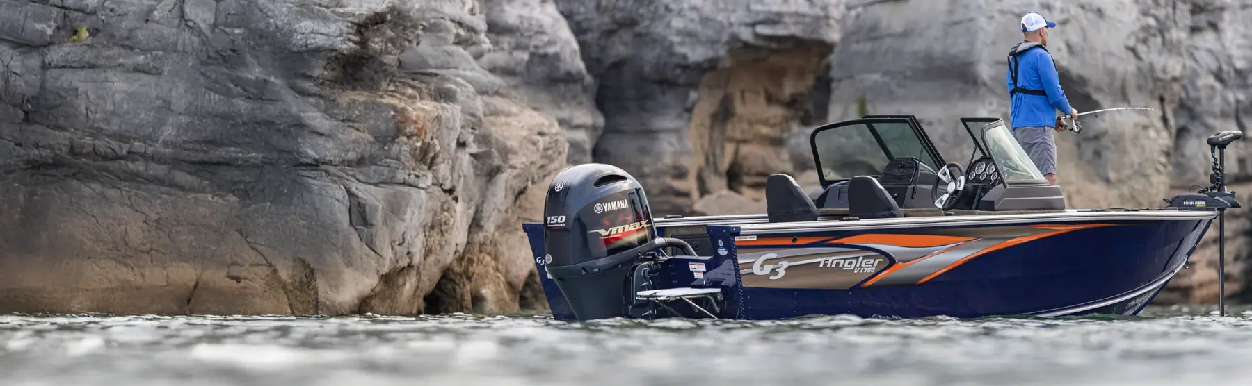 A person fishing in a lake on a G3 Angler boat.
