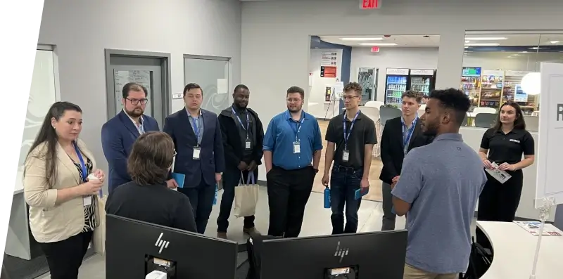 A group of Siren Marine employees in an office.