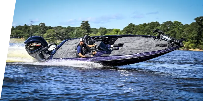 A boater speeding a Skeeter boat around a turn in a lake.