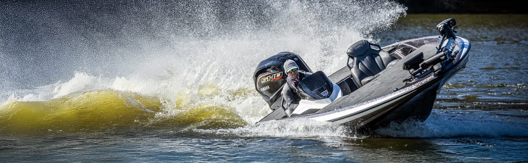 A person in a Skeeter fishing boat cruising across the water