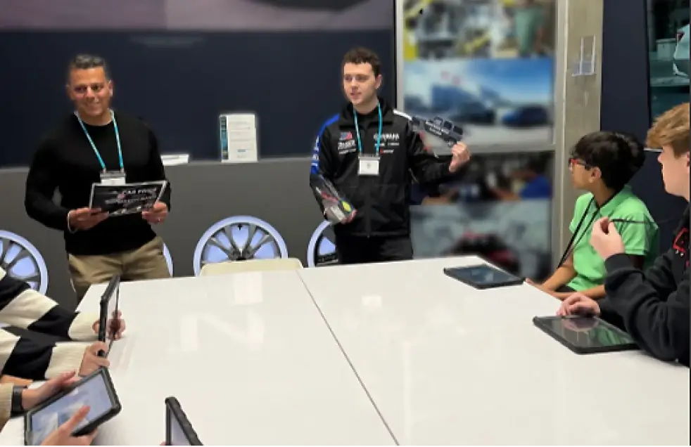 Yamaha employees teaching students at a community event.