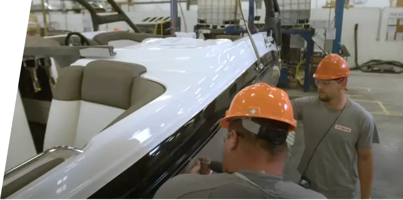 Yamaha employees building a boat on the manufacturing floor.