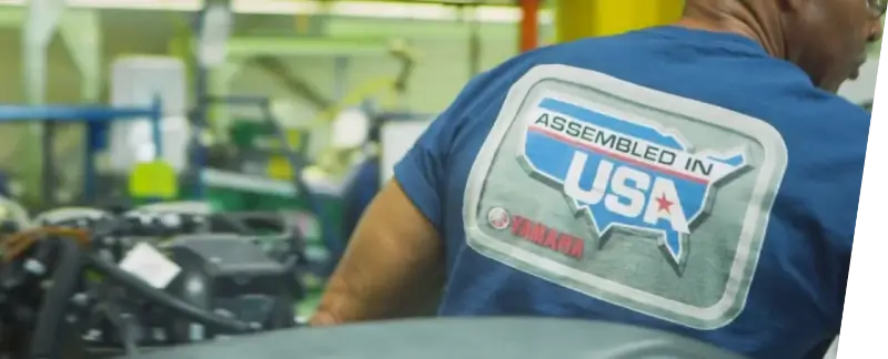 A Yamaha employee wearing a shirt that says “Assembled in USA.”