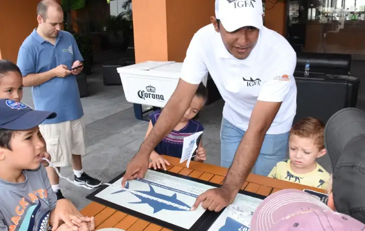 Children learning about marine animals at a charity event.