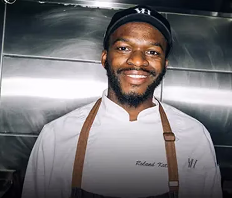 A dishwasher looking forward and smiling.