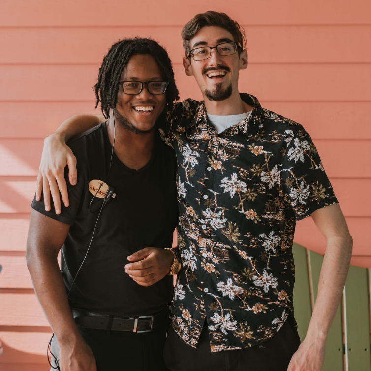 Two Bahama Breeze employees smiling
