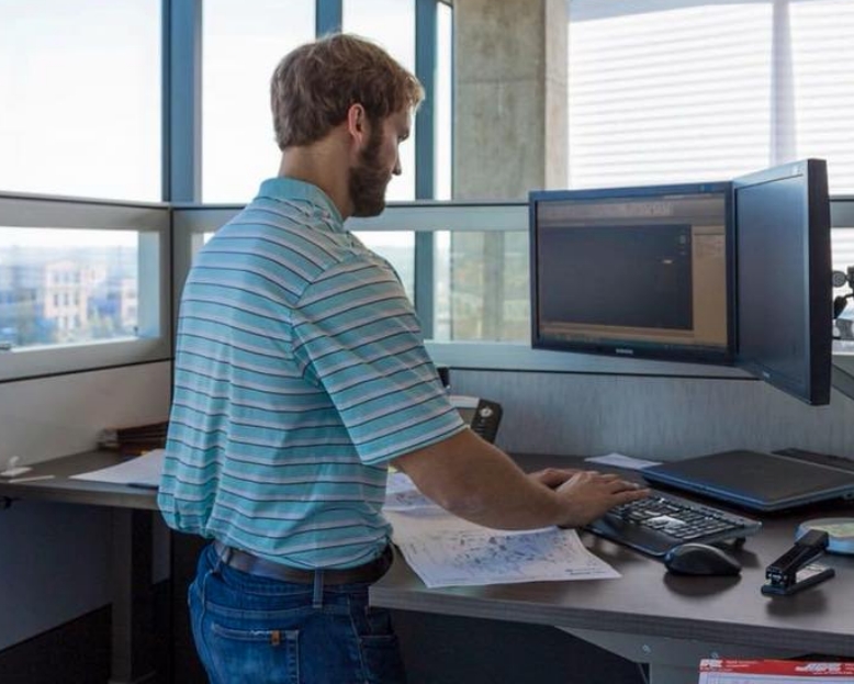 Barge employee working on a computer at his desk