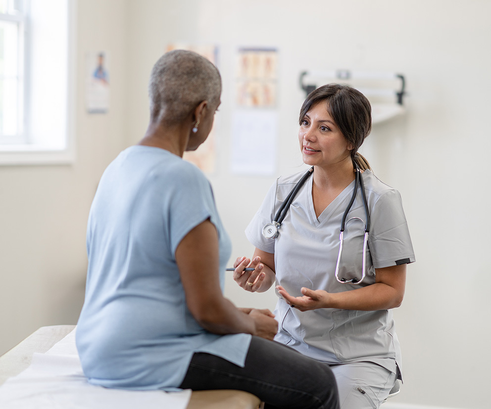 Better Health Group nurse consulting with a patient.