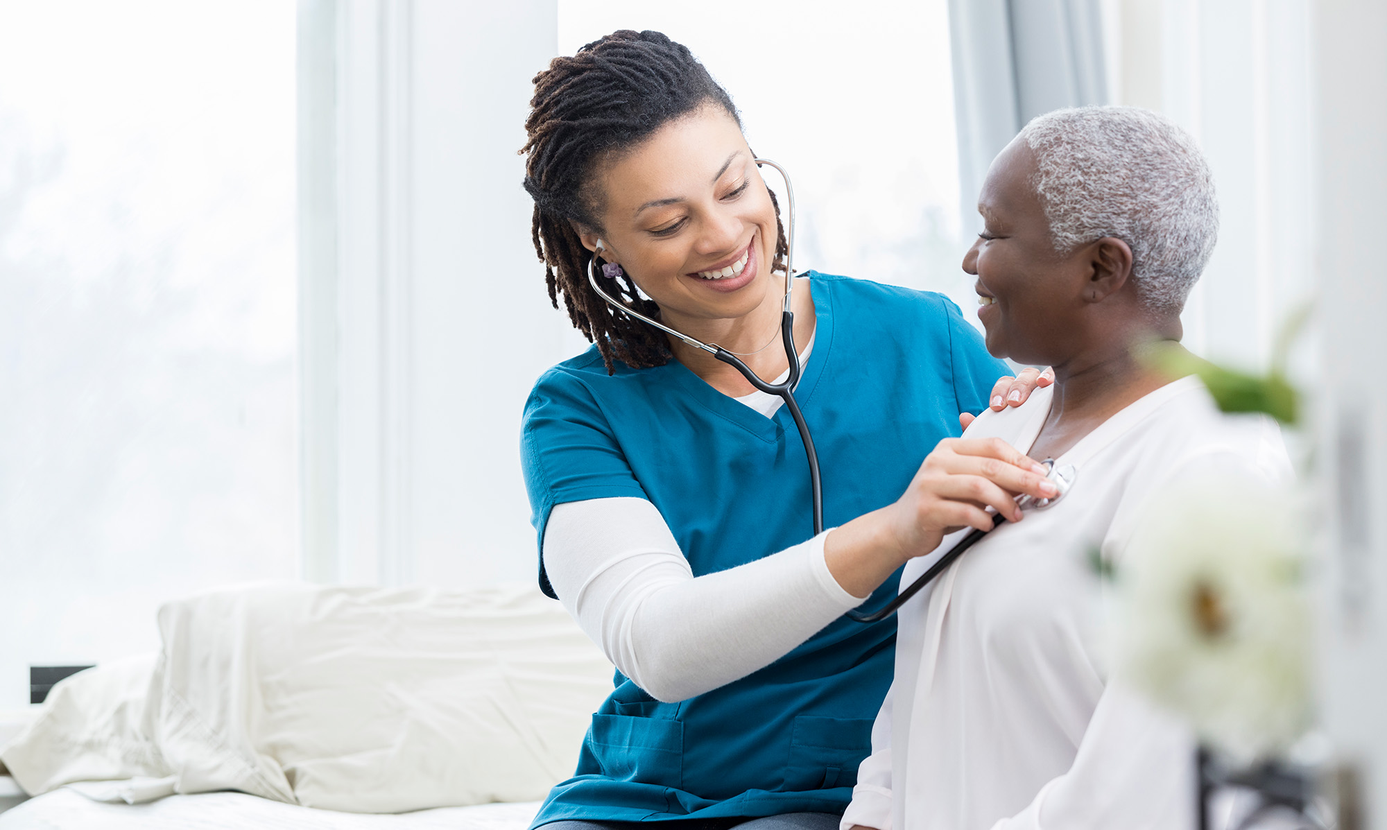 VIPCare nurse smiling with a patient.